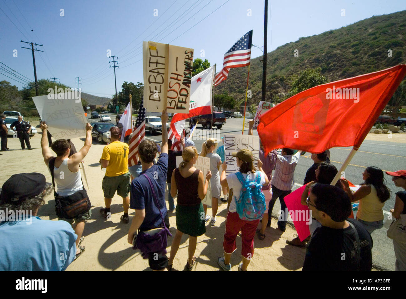 White & Hispanic demonstrators support  minority day laborers at a day laborer hiring center in Laguna Beach, CA. Stock Photo