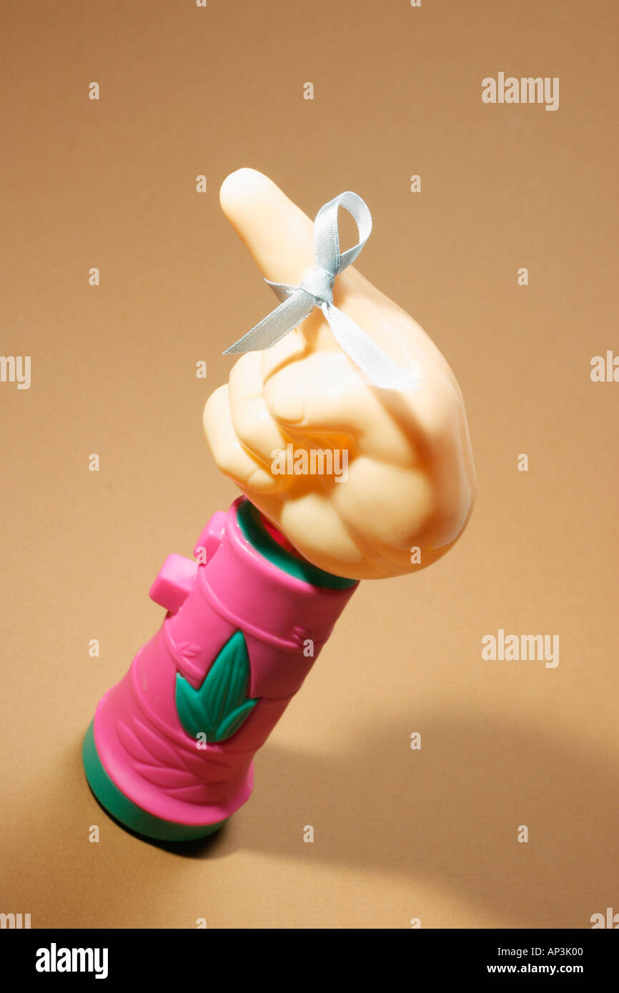 Plastic Toy Hand with Ribbon Stock Photo Alamy