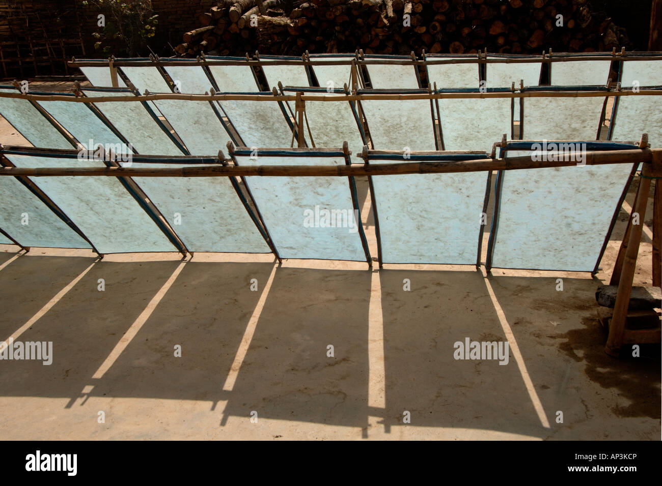 Hand made paper drying in trays in sun Yunnan China Stock Photo