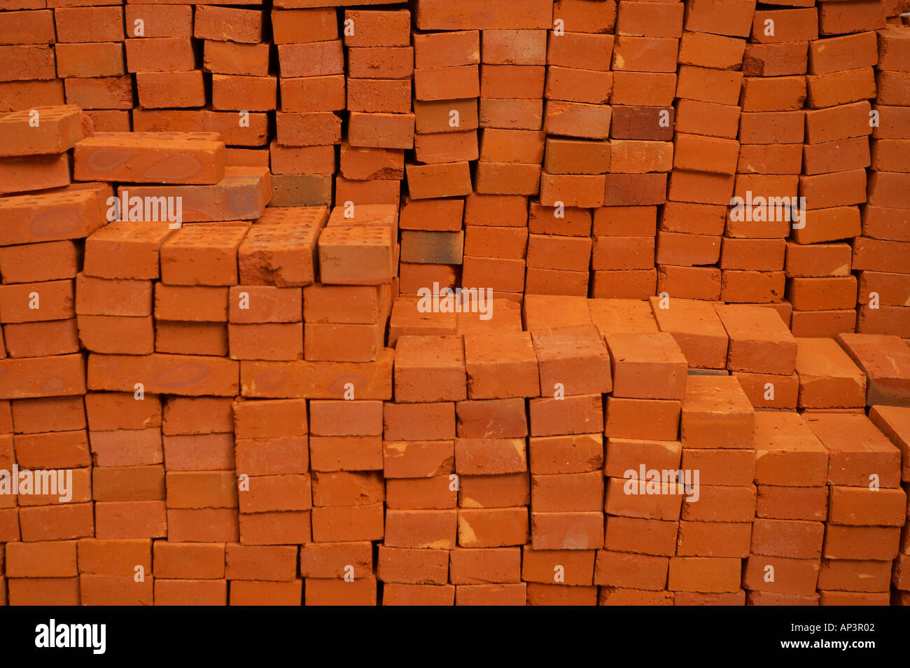 PILE OF RED BRICKS ON BUILDING SITE Stock Photo