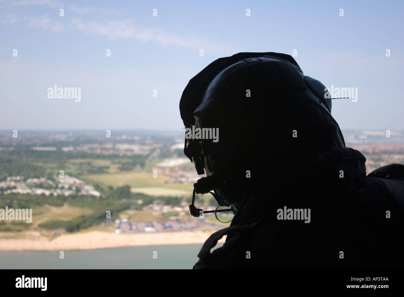 crew member looks out over gosport area from the air england uk Stock
