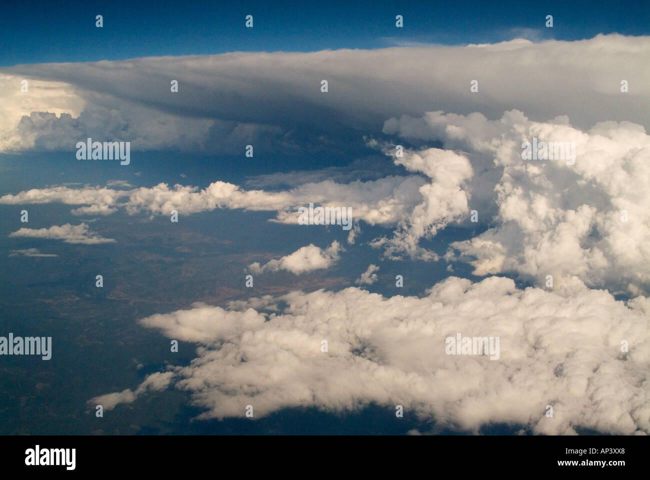 An aerial view of shelf like Cumulonimbus clouds fronted by Cumulus ...