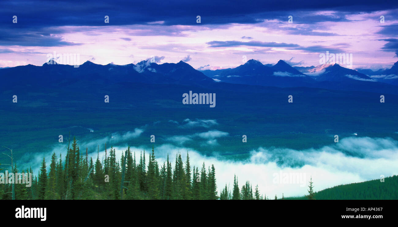 Cloudy sky with mountain forest hi-res stock photography and images - Alamy