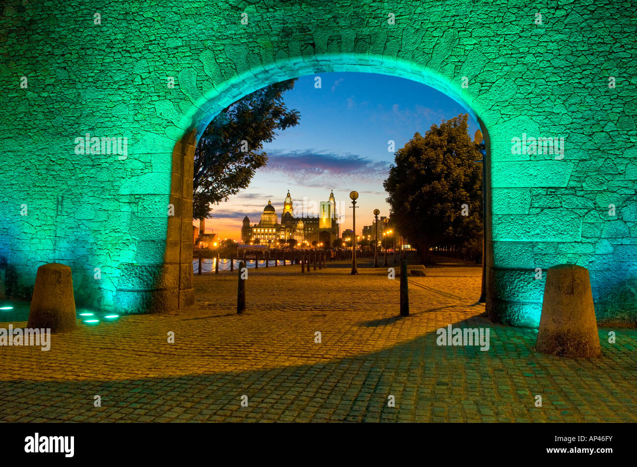 View through the Wapping Arch at night showing the Albert Dock, Liverpool Stock Photo