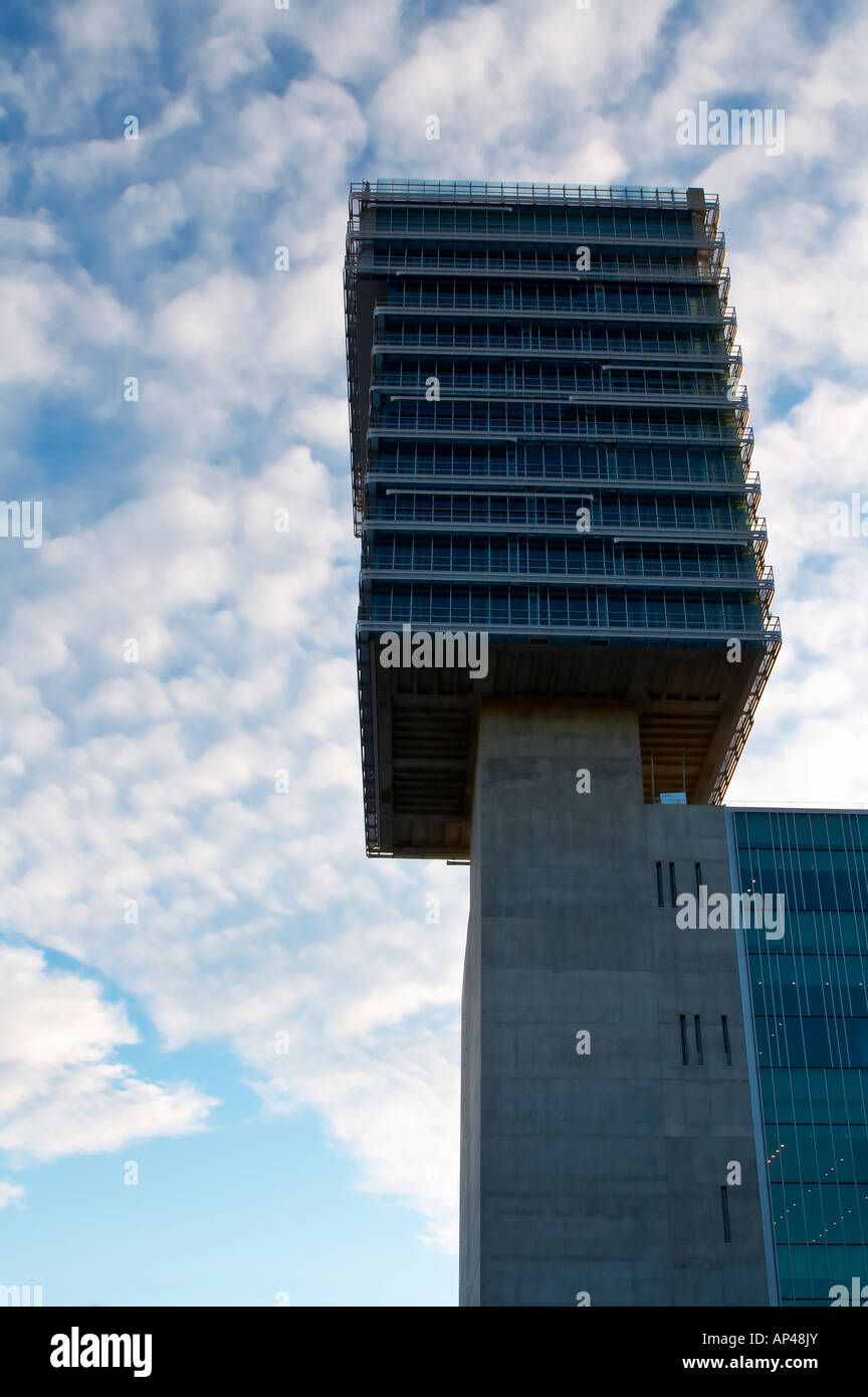 Corporate building over a cloudy blue sky background Stock Photo - Alamy