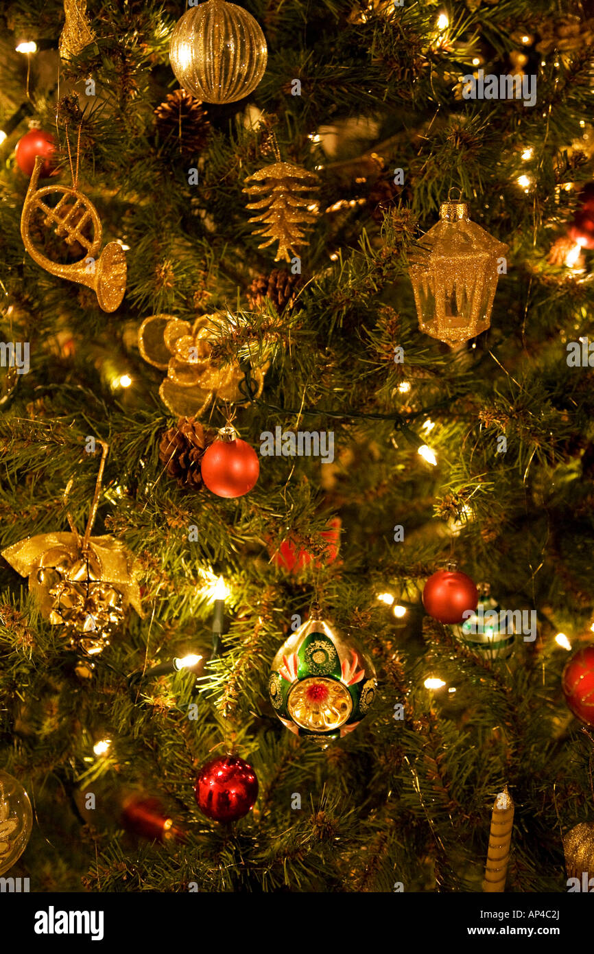 FESTIVE DECORATIONS ON CHRISTMAS TREE IN ENGLISH HOME Stock Photo - Alamy