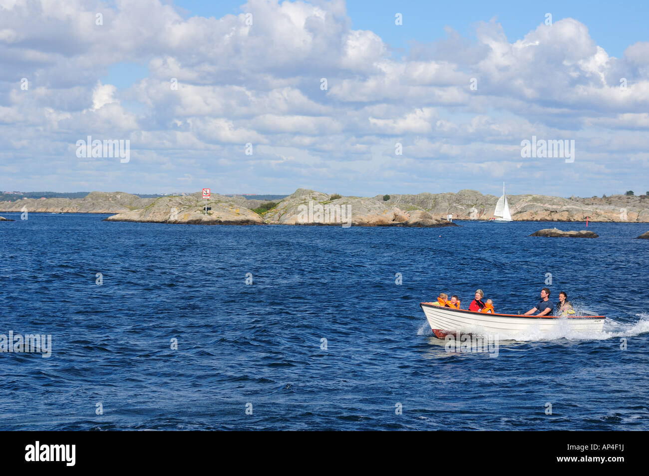 Tourists riding in boat, Sweden Stock Photo