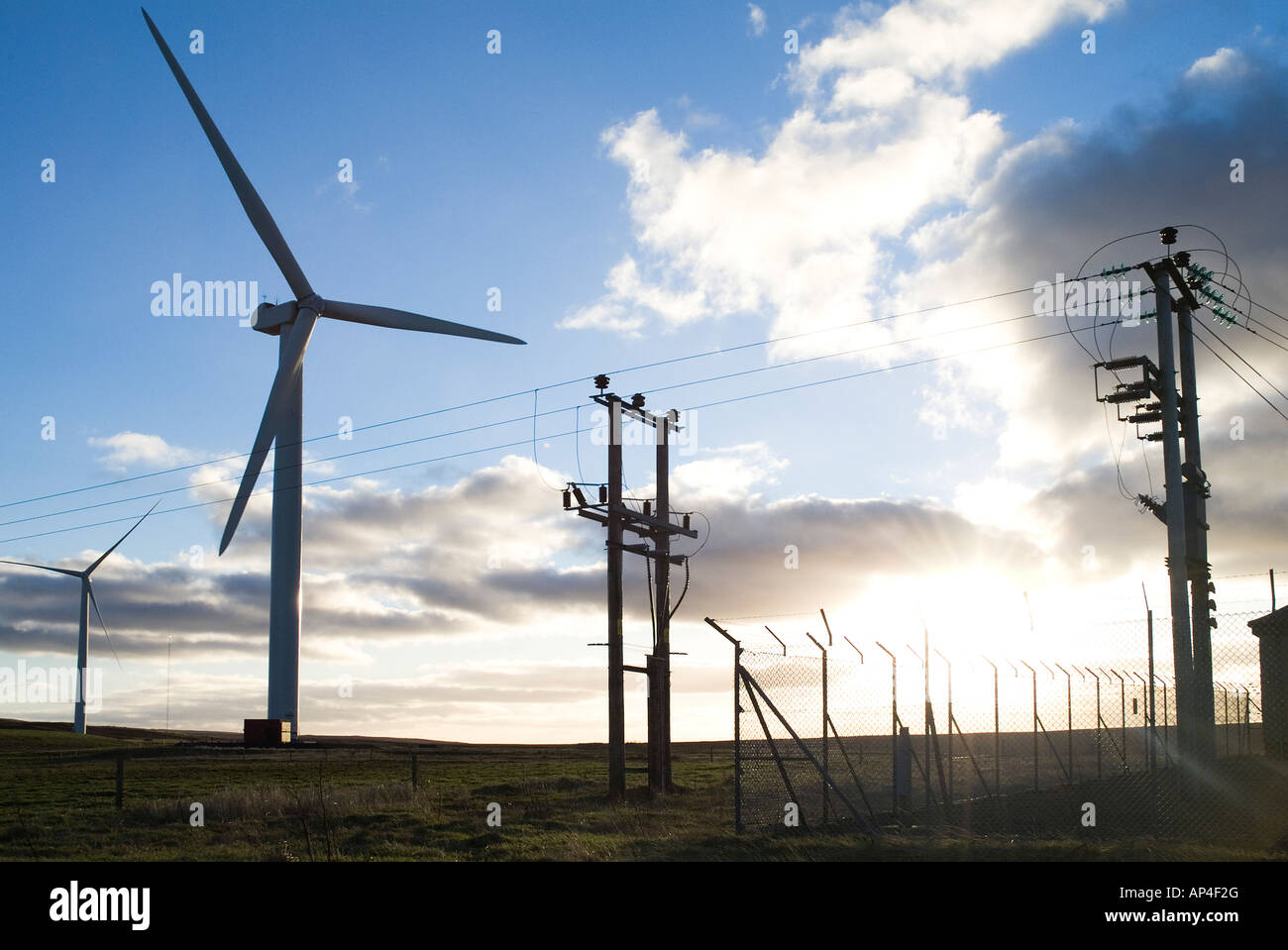 dh Burgar Hill Orkney Nordex N80 ELECTRICITY UK Wind farm turbine power lines uk windfarm scotland silhouette turbines electrical substation supply Stock Photo