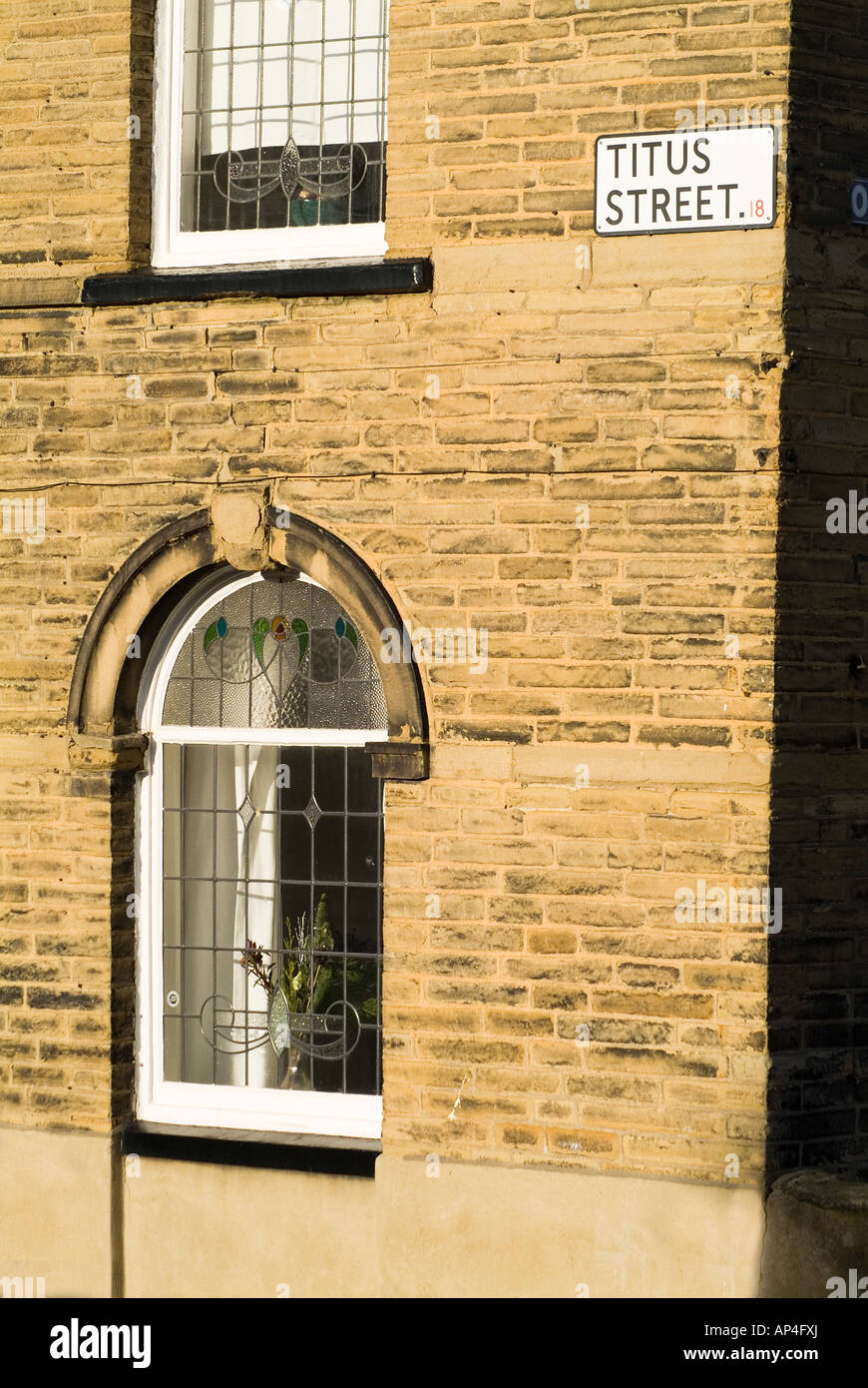 dh  SALTAIRE WEST YORKSHIRE Titus street sign in Titus Salt Victorian village exterior house Stock Photo