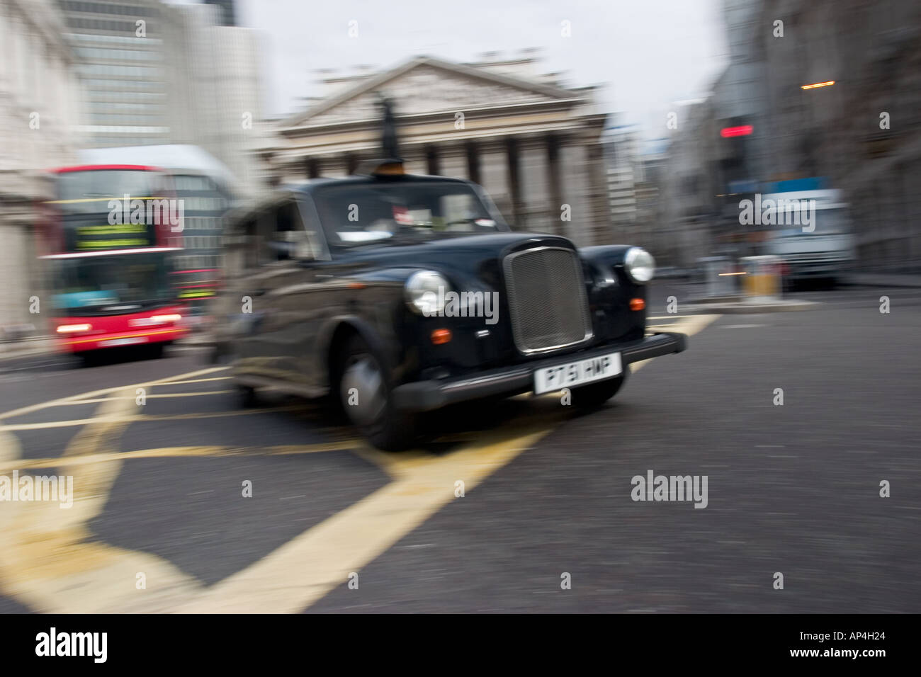 Black cab crosses over Bank junction in the heart of London s financial district Stock Photo