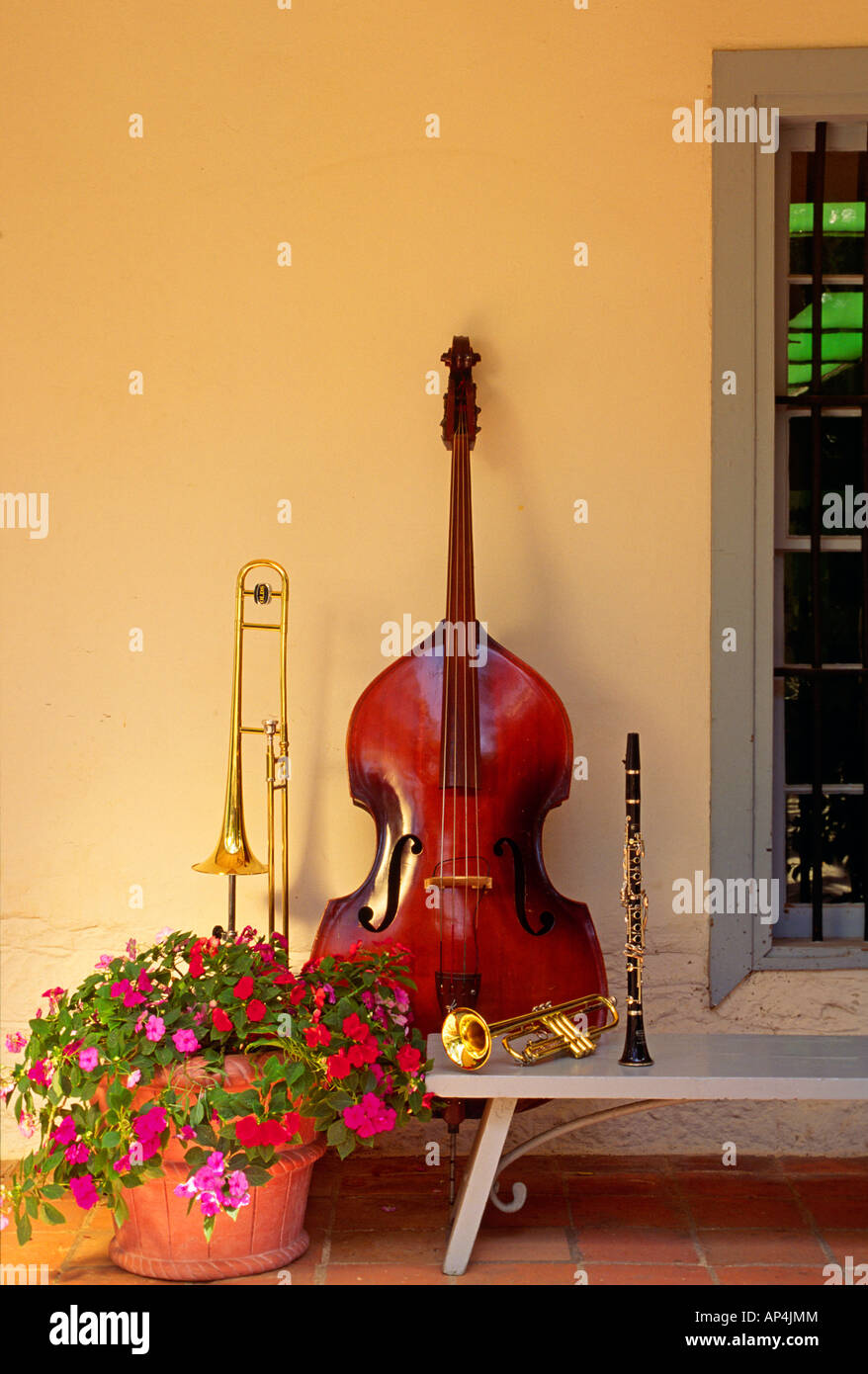 INSTRUMENTS display outside old building with pot of FLOWERS BASS ...