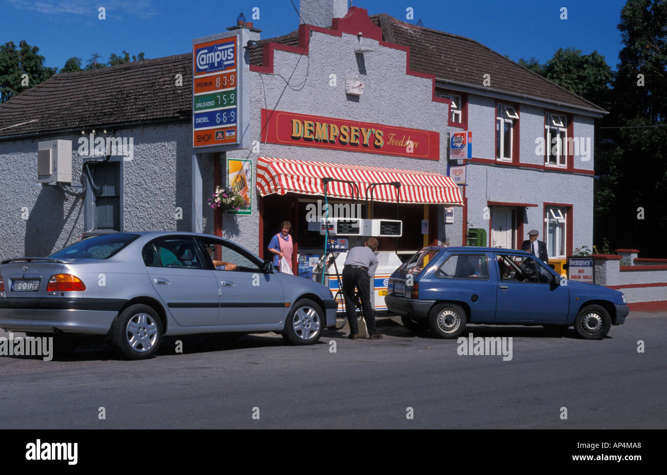 Petrol pump in front of a shop in a small village Minane Bridge in Ireland Stock Photo