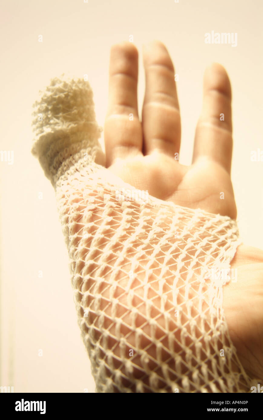 Wounded hand bandaged Stock Photo