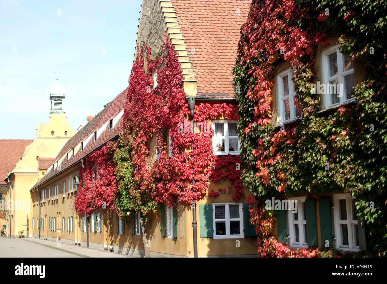 overgrown quaint houses at the Fuggerei oldest social settlement in the