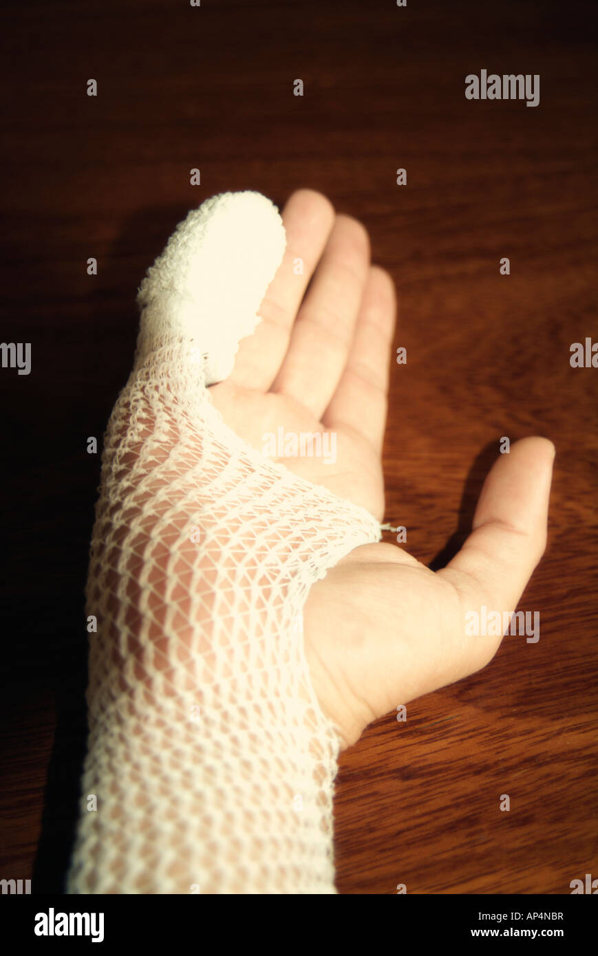 Wounded hand bandaged Stock Photo