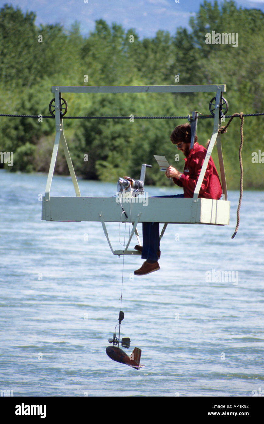 Hydrologist tests water quality and stream flow in the Boise River Idaho  Stock Photo