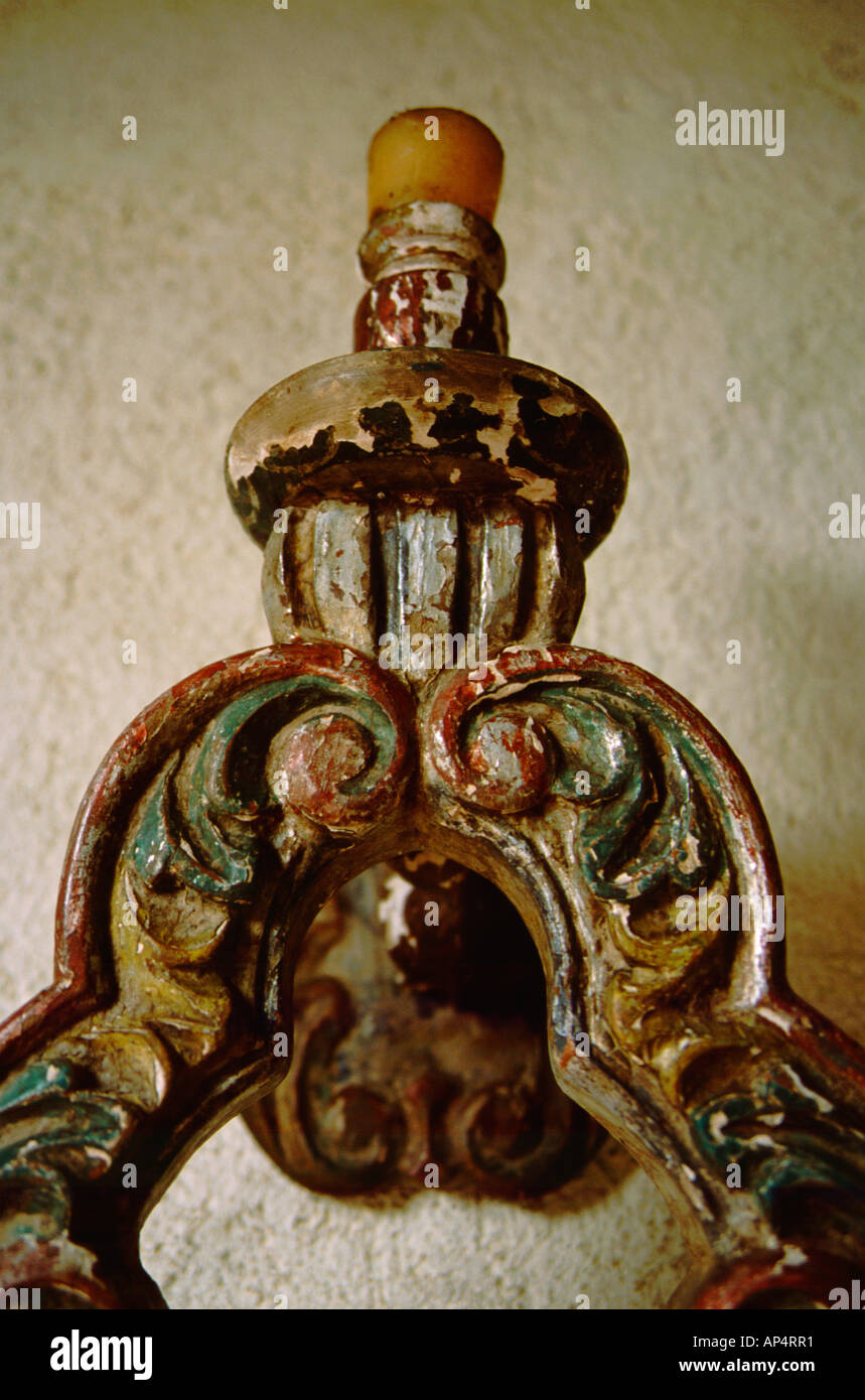 Central America, Nicaragua, Leon. El Convento Hotel. Antique wall candle sconce with peeling paint. Stock Photo