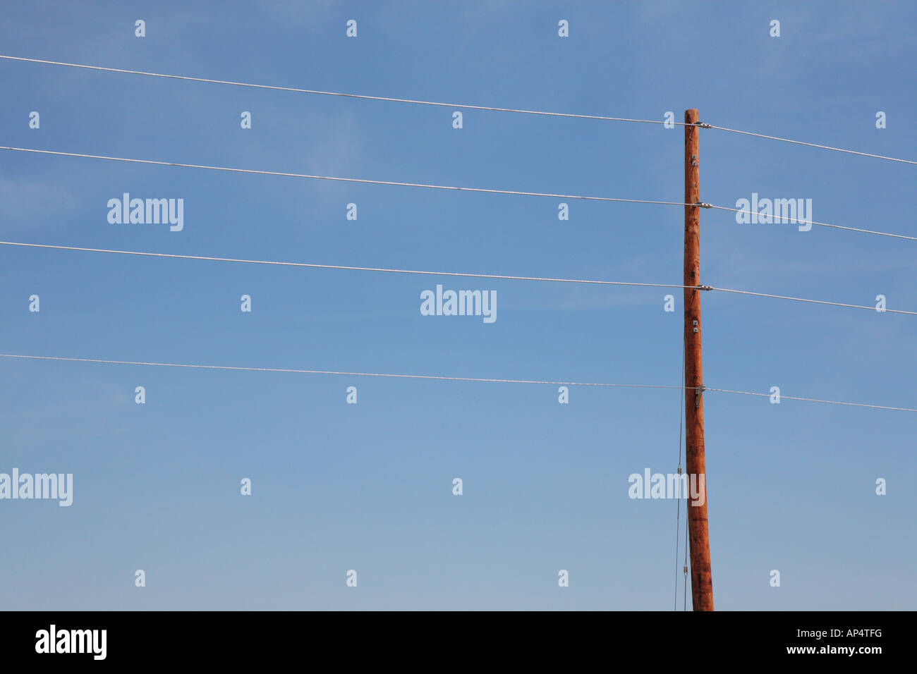 POWER LINES A WOODEN POLE AND THE BLUE SKY Stock Photo - Alamy