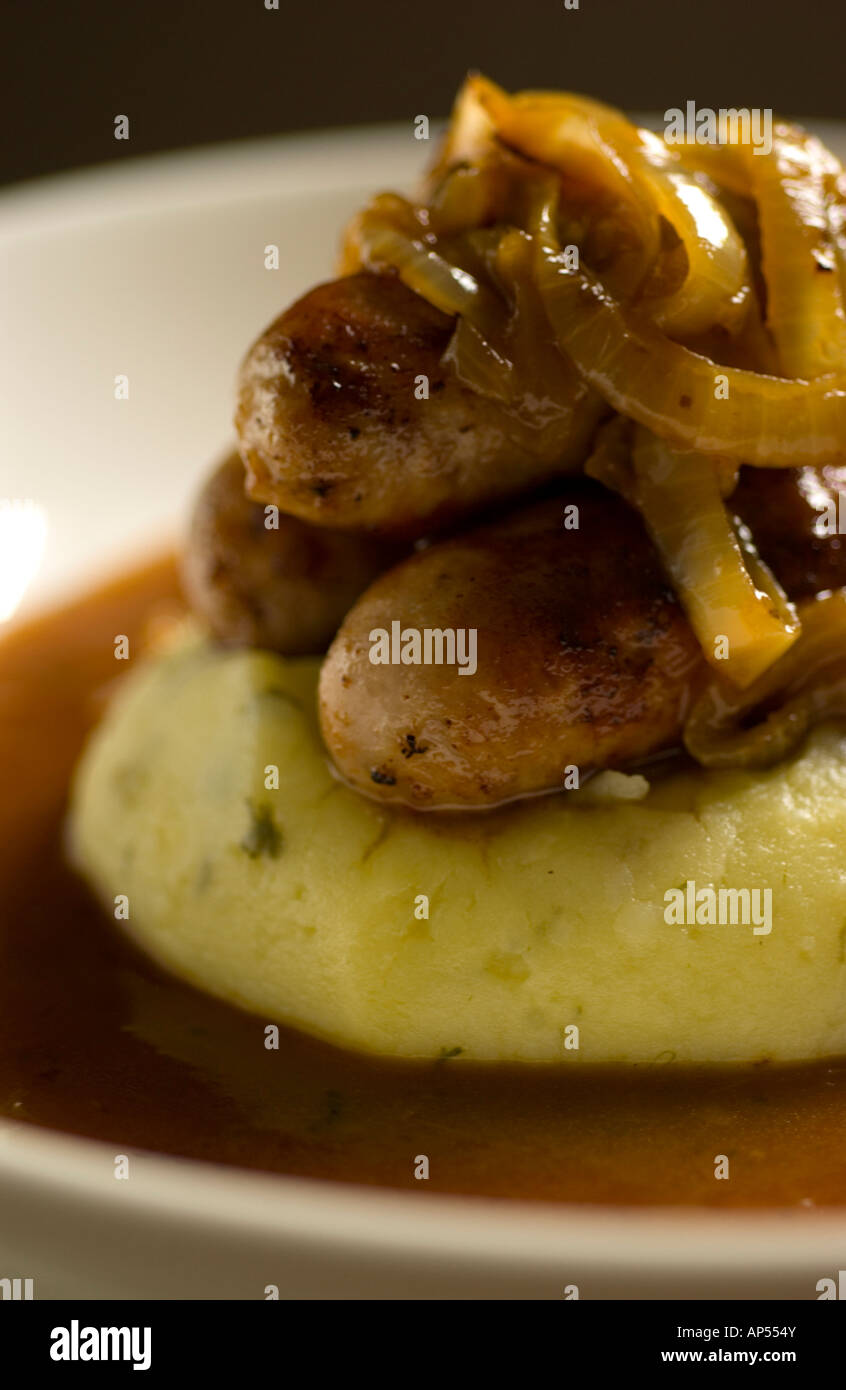 Bangers and Mash with onion gravy on a white dish Stock Photo Alamy