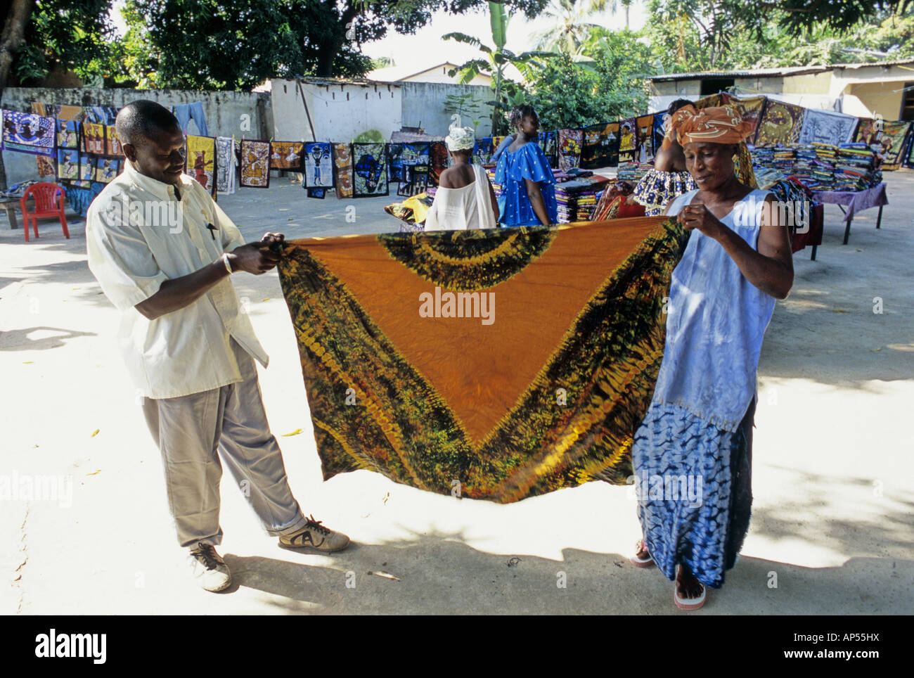 Traders selling damask and batik cotton clothes and tablecloths show