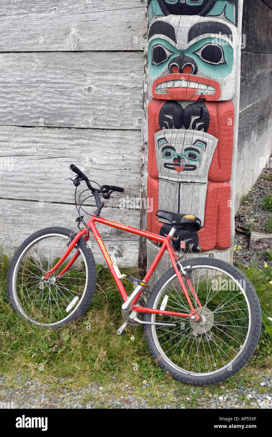 Bicycle against a totem pole from the Tlingit tribe adorning the