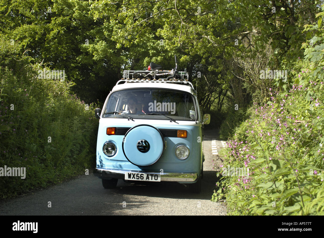 Volkswaggon campervan in tiny country lane in south east cornwall England Stock Photo
