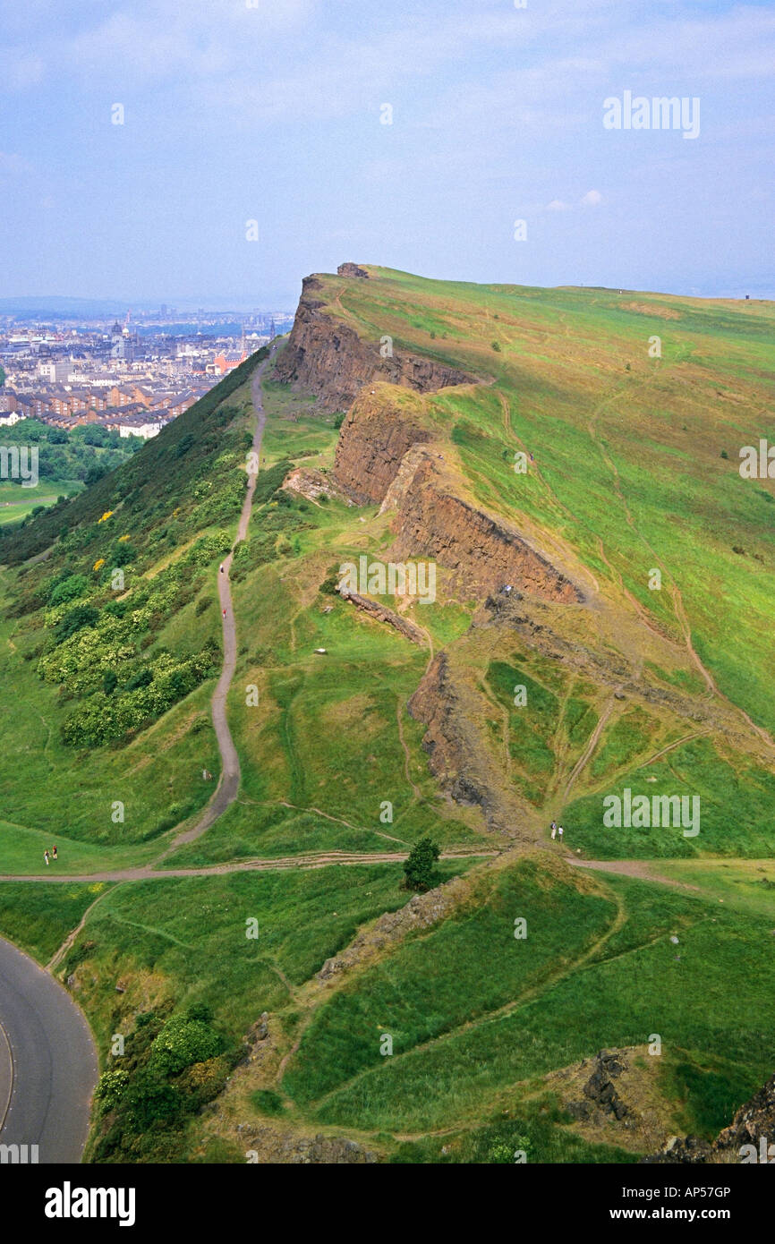 Walkers on Salisbury Crags and the Radical Road in Holyrood Park Edinburgh Stock Photo