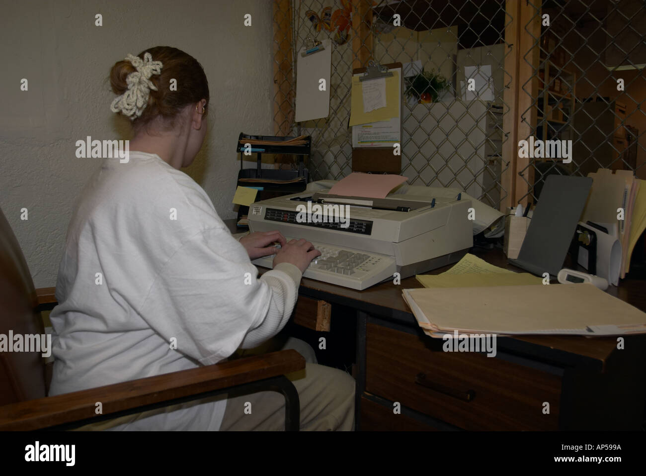 Female inmate typing documents Nebraska Correctional Center for Women Stock Photo