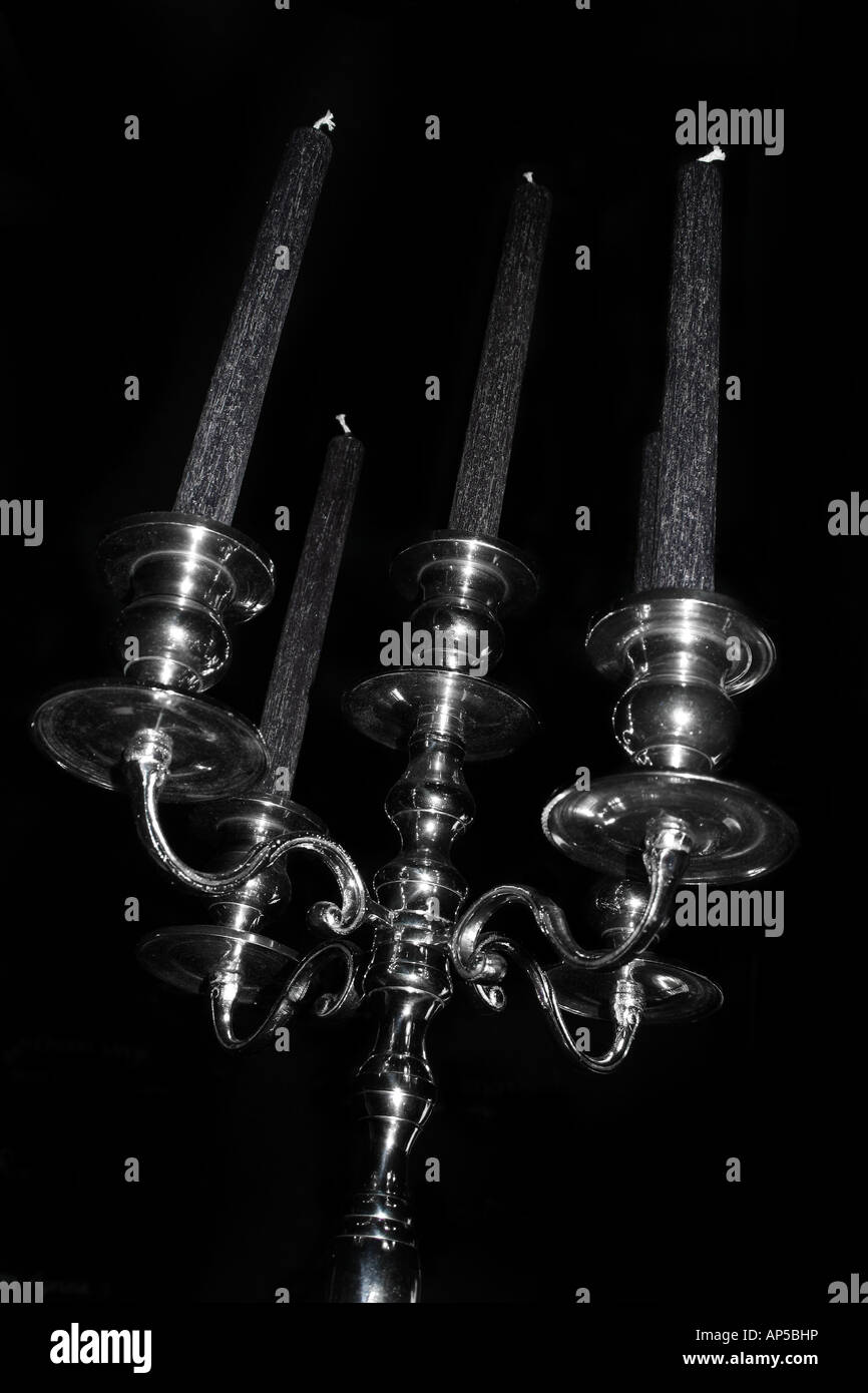 black candles in candelabra Stock Photo Alamy
