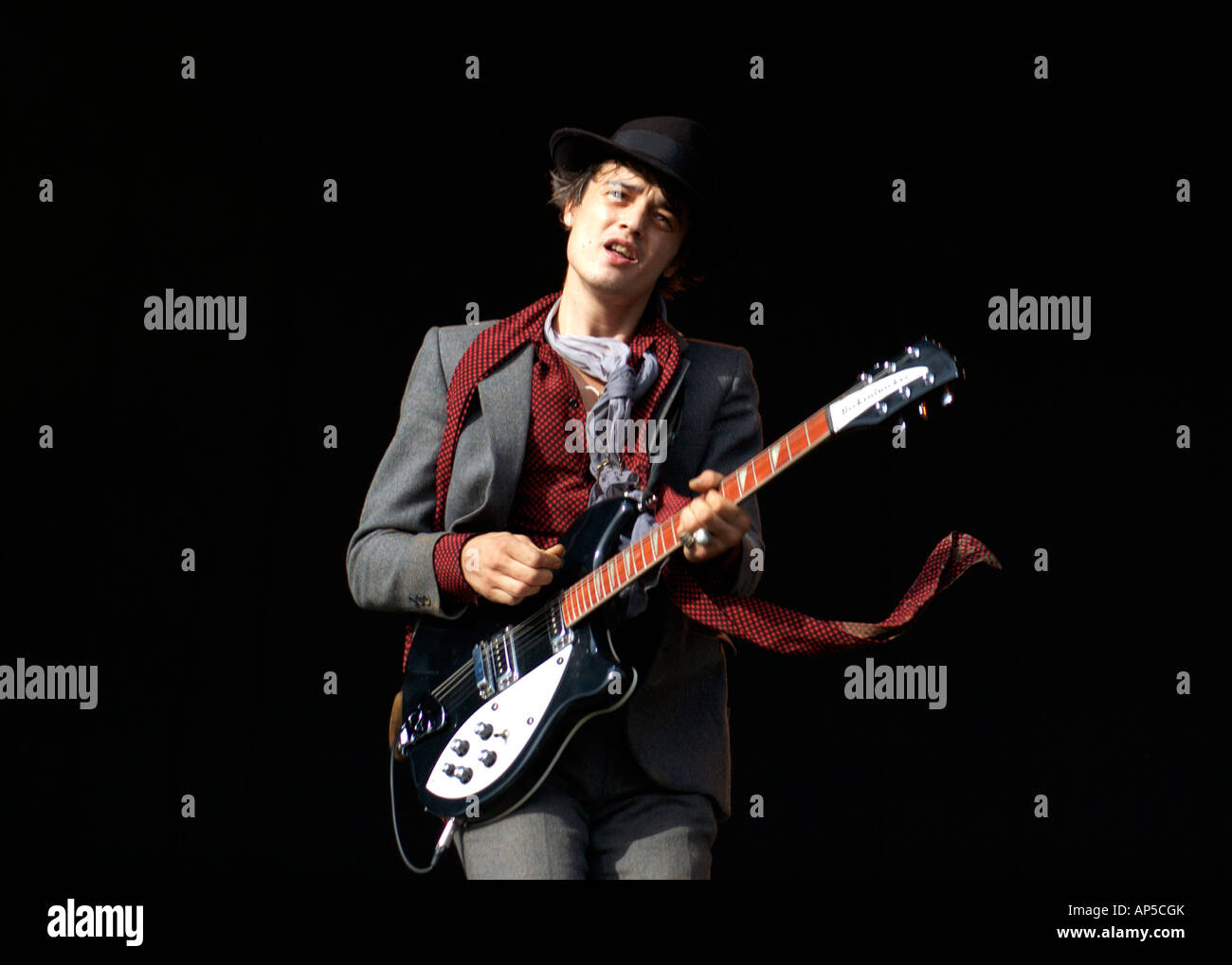Pete Doherty looking healthy playing guitar on a windy day Glastonbury 2007 Stock Photo