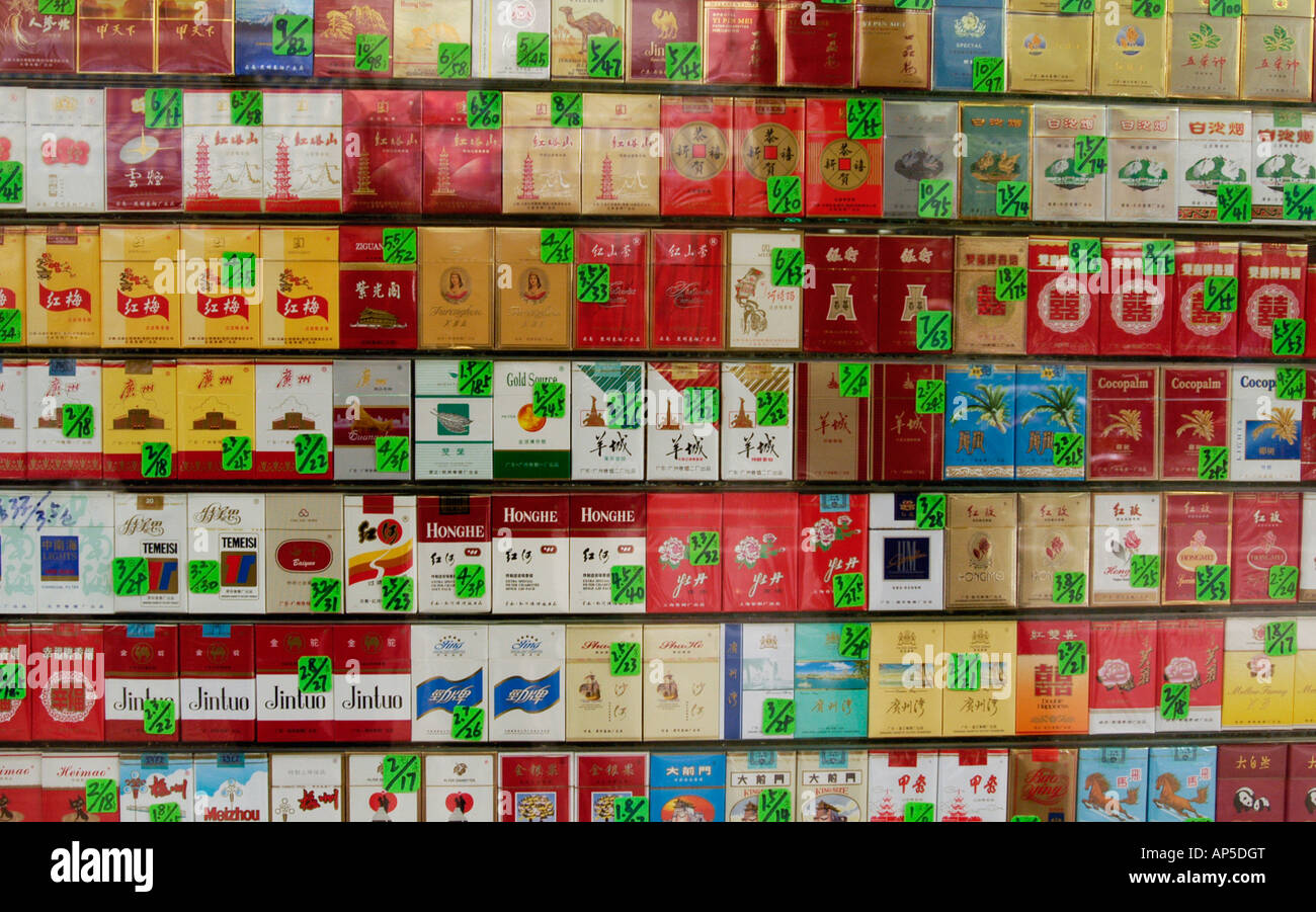 Many brands of Chinese cigarettes for sale in shop window in China 2007 Stock Photo