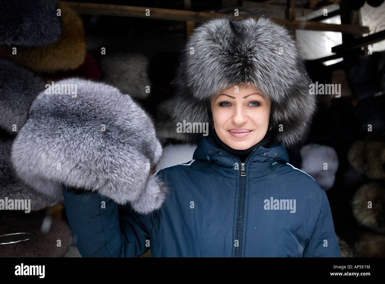 Woman selling fur hats in market at Yuzhno Sakhalinsk Sakhalin Island Russia Stock Photo