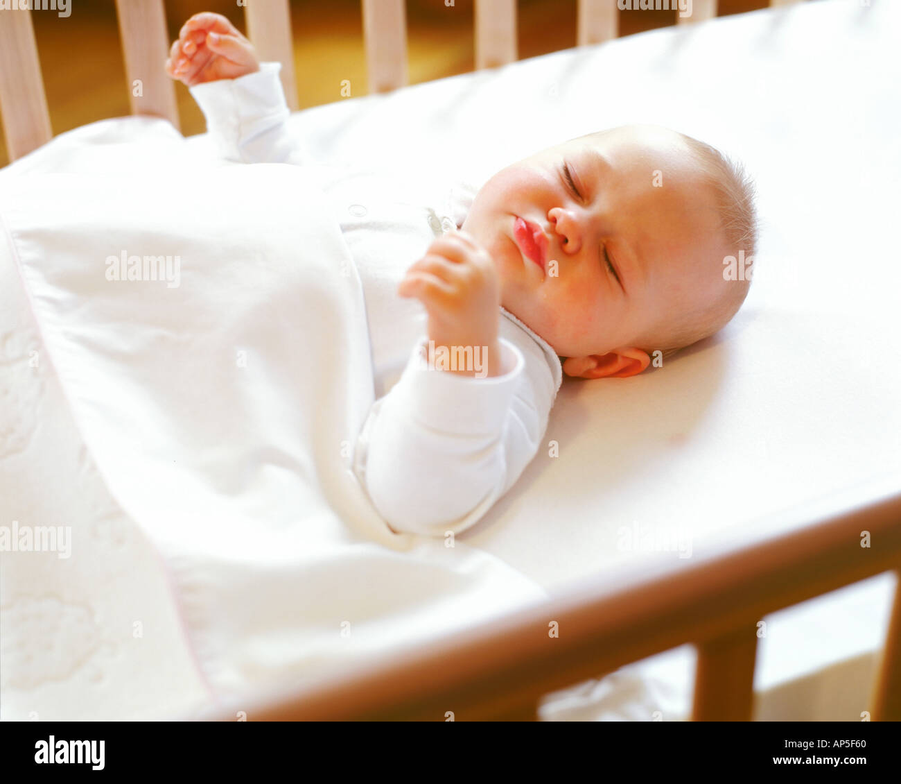 Baby at cot hi-res stock photography and images - Alamy