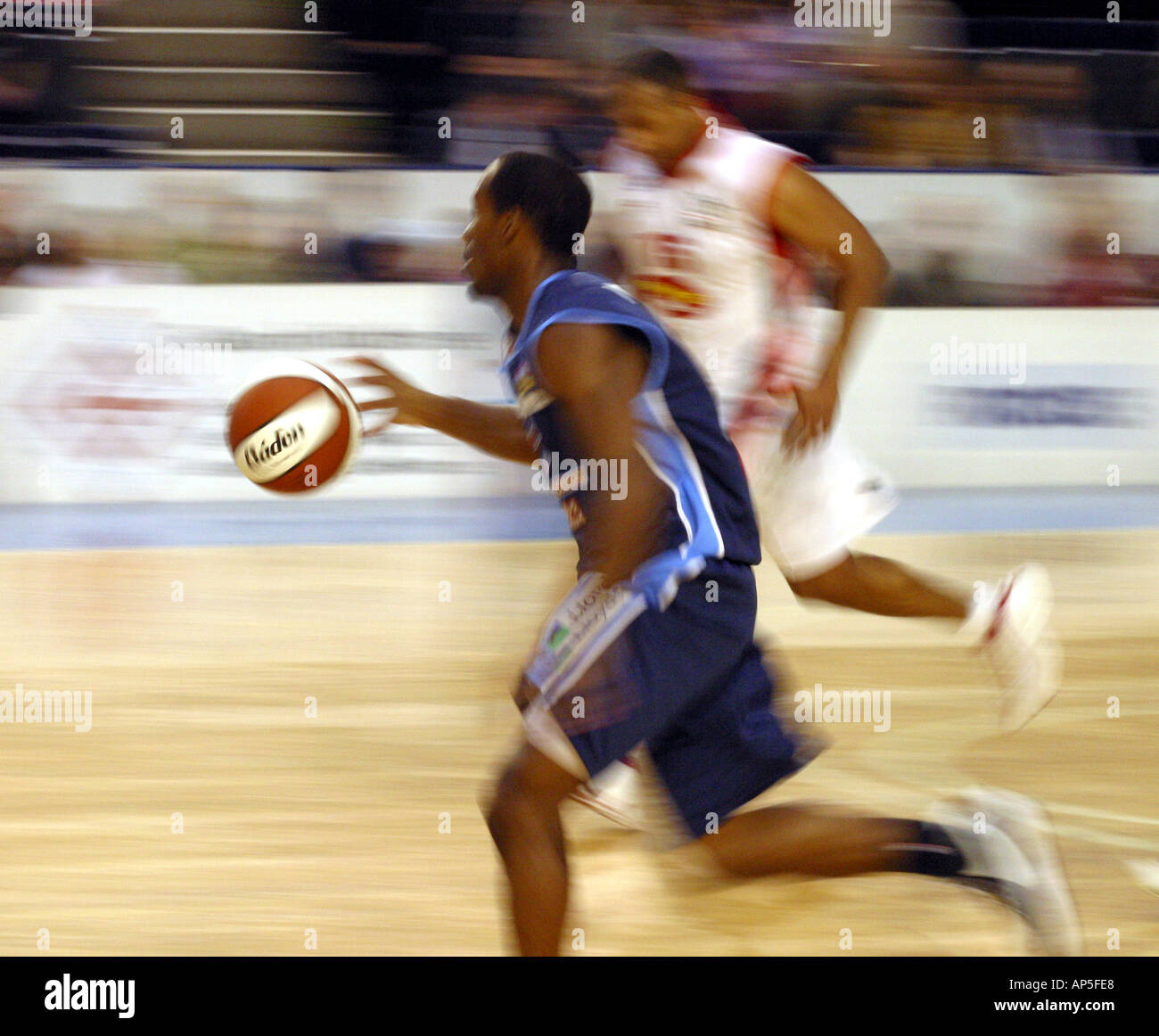 High speed basketball game action Stock Photo - Alamy
