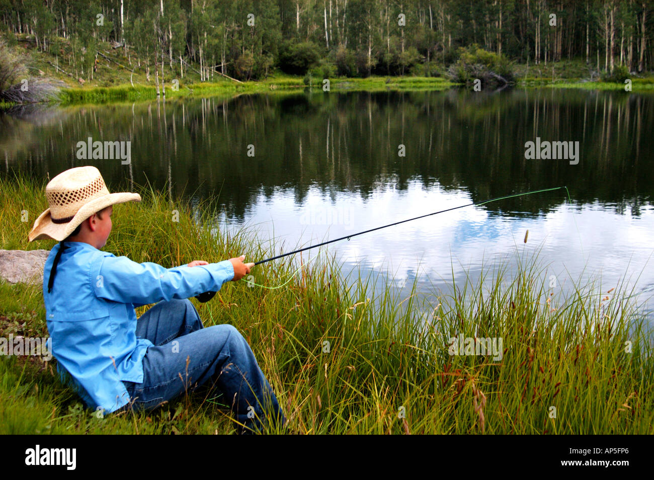 Young cowboy fishing hi-res stock photography and images - Alamy