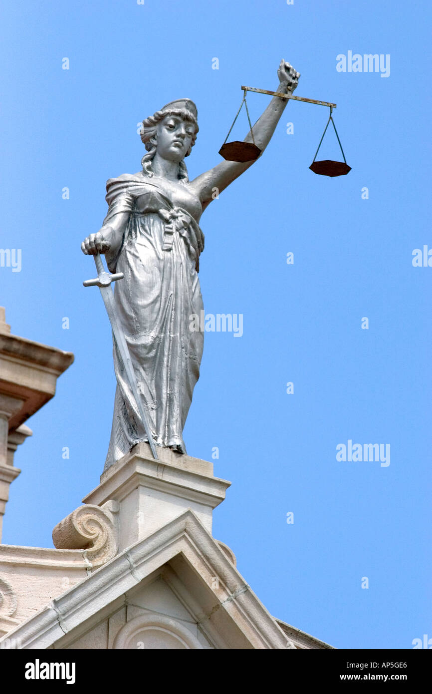 Lady Justice statue with scales of justice on top of the courthouse ...