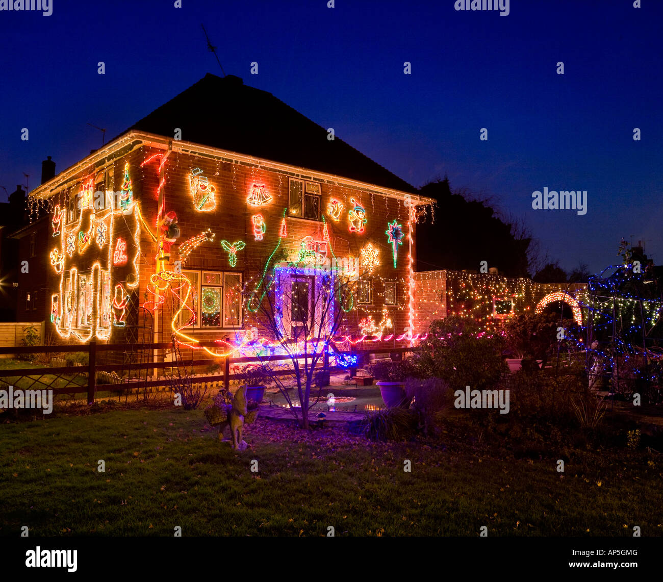Detached house covered in Christmas lights Stock Photo Alamy