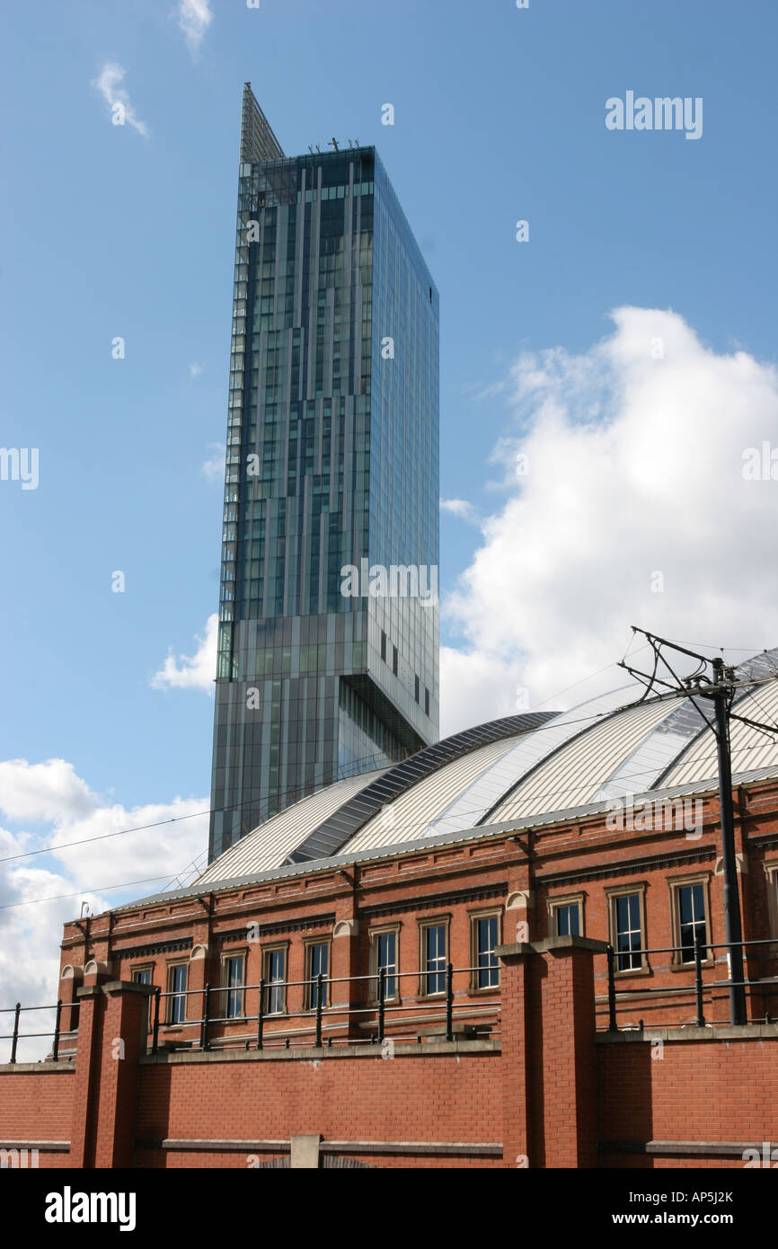 Hilton Tower also known as Beetham Tower with GMEX and Metrolink tram line in foreground Manchester UK Stock Photo