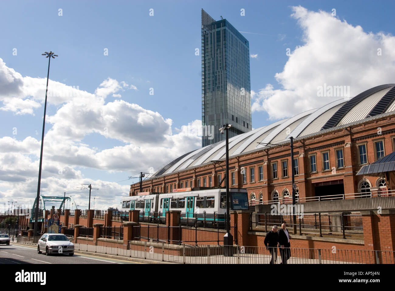 Hilton Tower also known as Beetham Tower with GMEX and Metrolink tram line in foreground Manchester UK Stock Photo