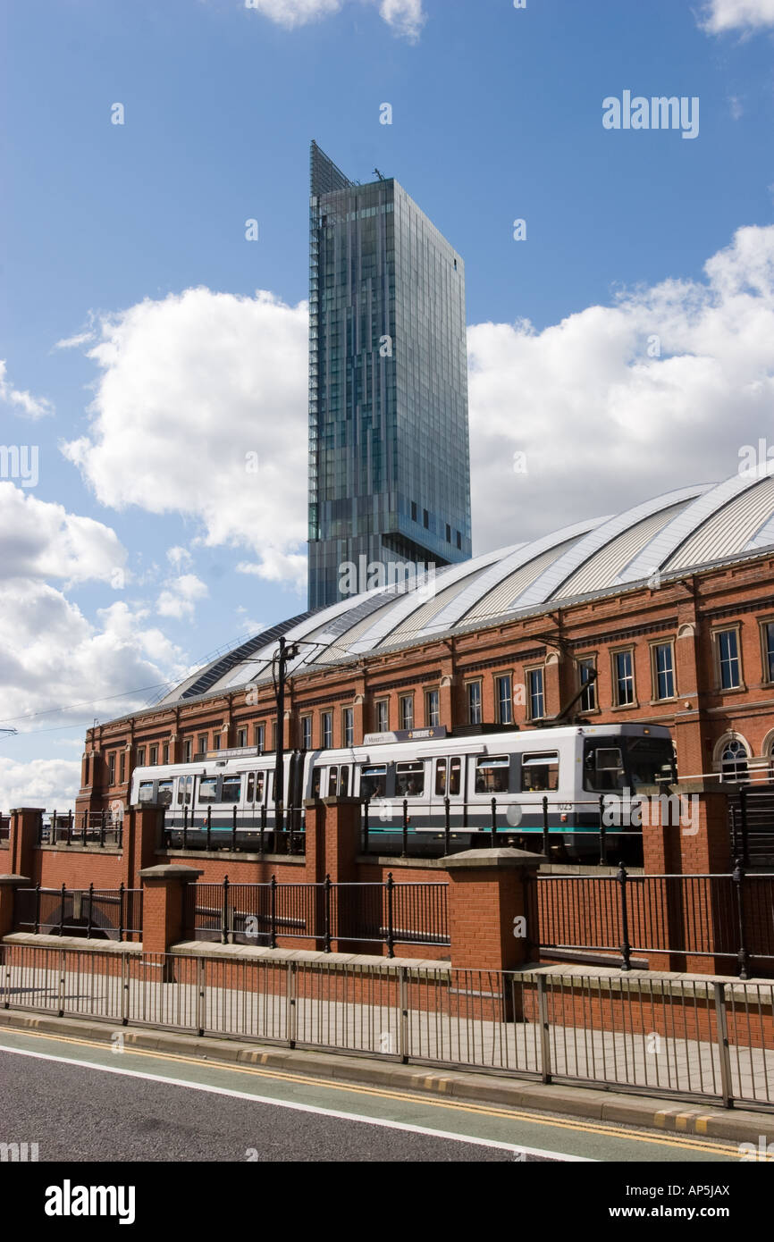Hilton Tower also known as Beetham Tower with GMEX and Metrolink tram line in foreground Manchester UK Stock Photo