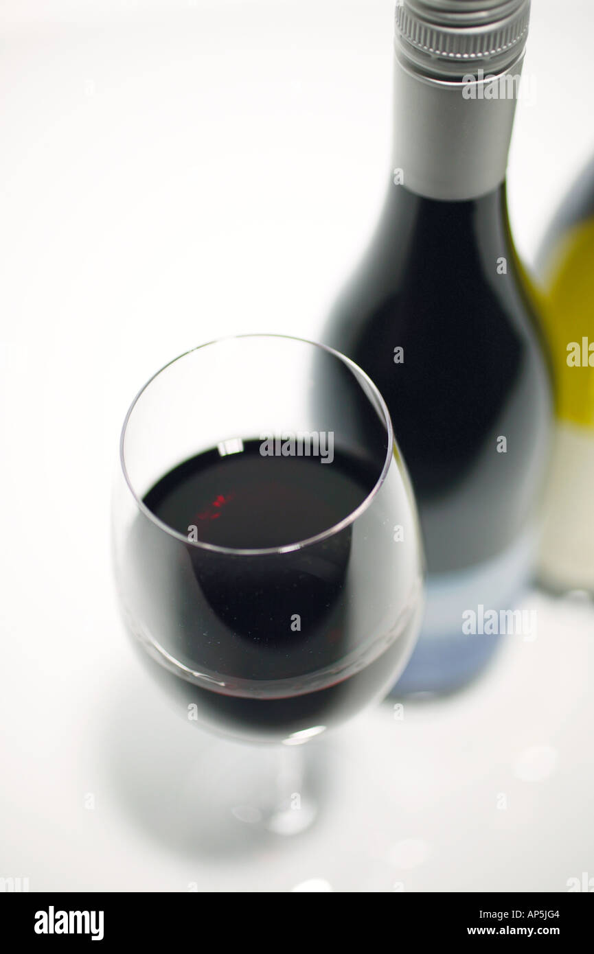 Studio Shot Glass Half Full Red Wine With Bottle White Background Stock ...
