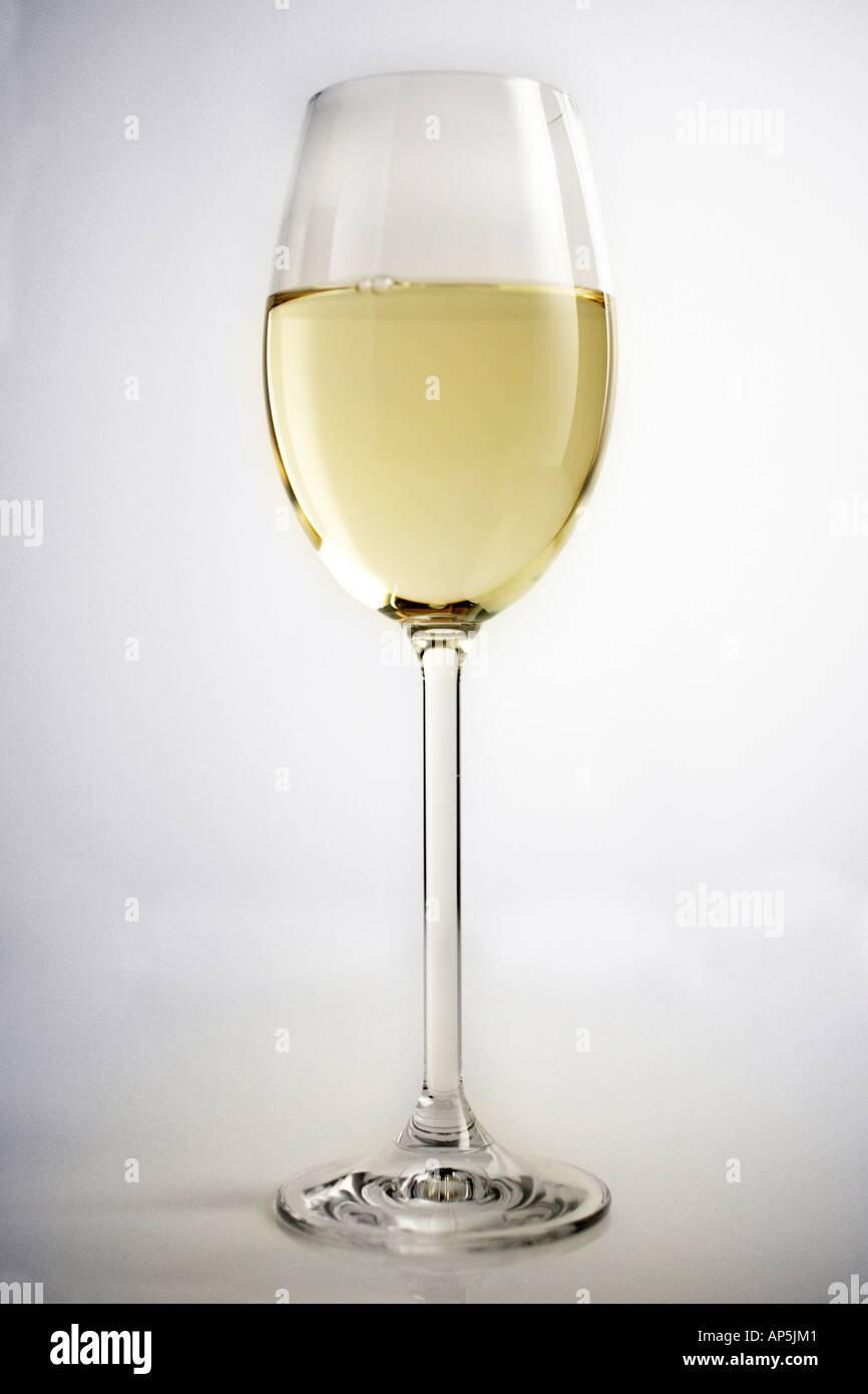 Single Glass Of White Wine, Half Full, White Background Stock Photo Alamy