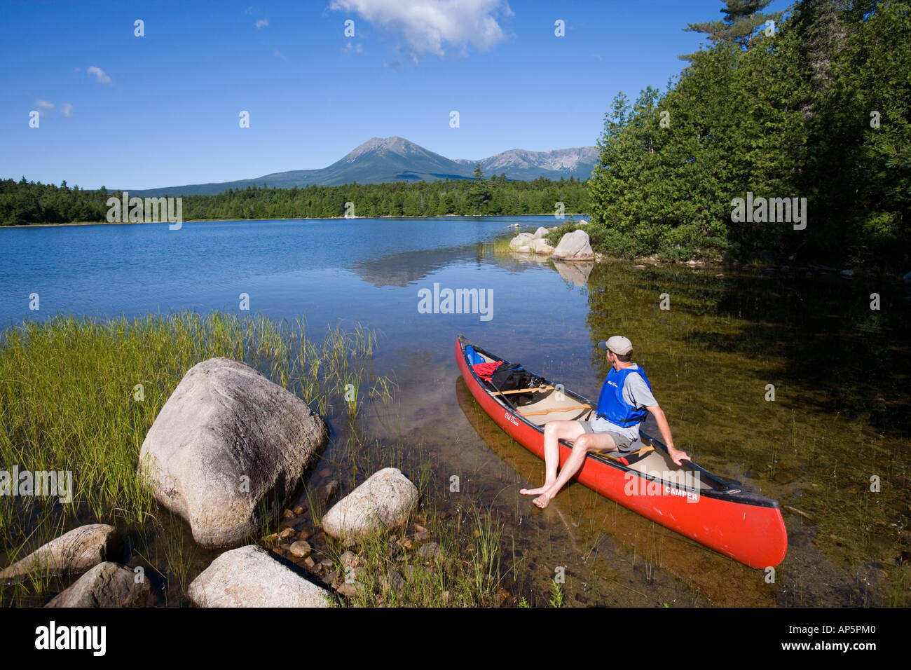 Canoeing on Maine's Katahdin Lake below Mount Katahdin, the highest