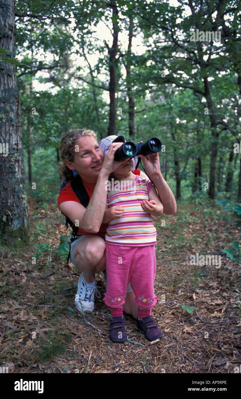 Harwich, MA A woman and her daughter explore a trail in the oak-pine forest near the Monomoy River in Harwich on Cape Cod. Stock Photo