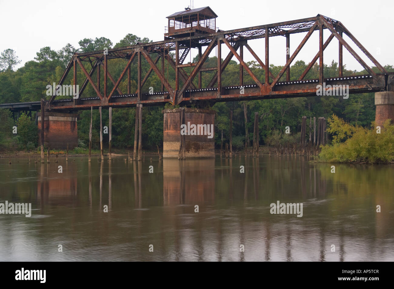 A steel railroad bridge over the Ocmulgee river in south