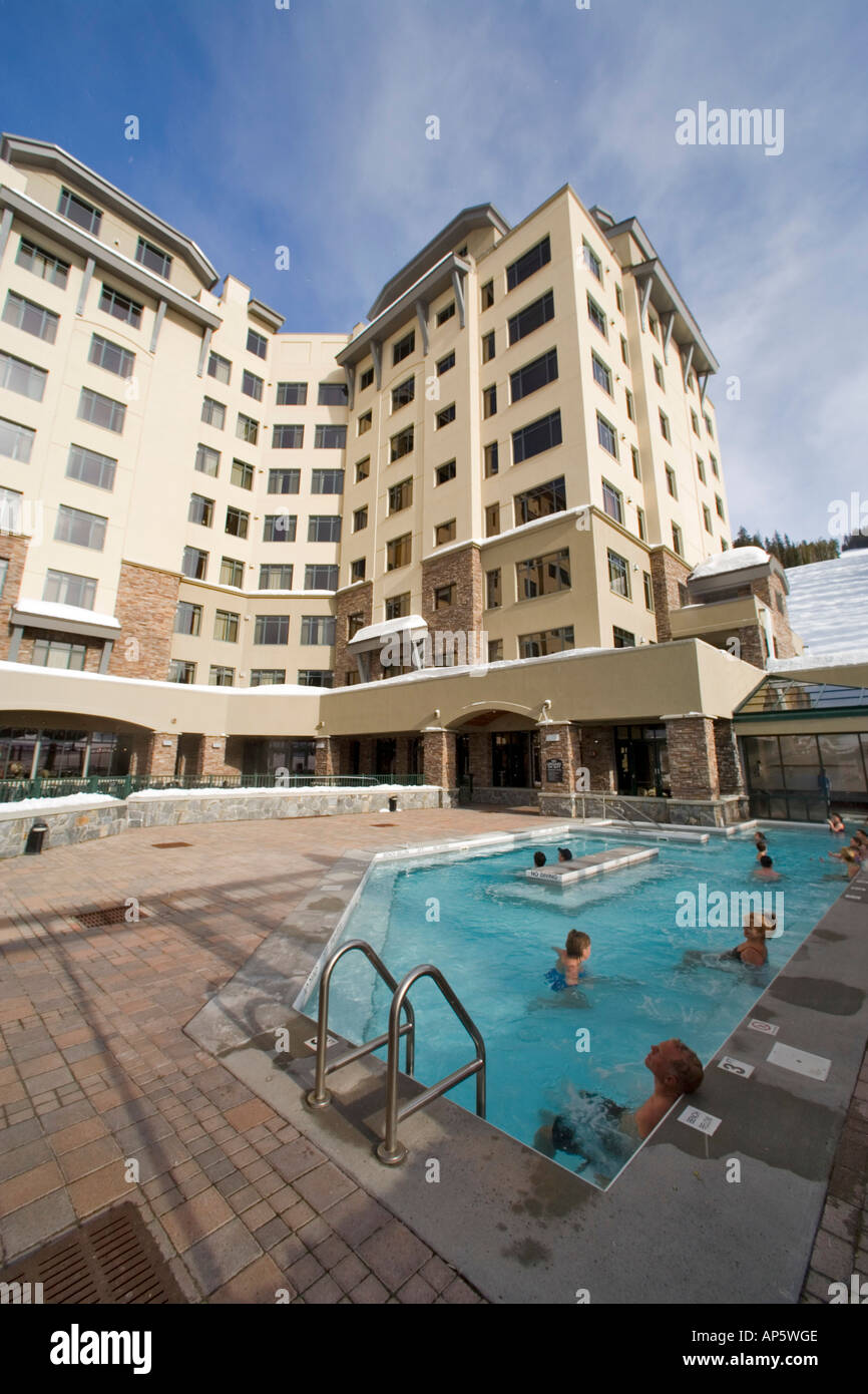 Guests enjoying the indoor/ outdoor pool at Summit Hotel in Big Sky