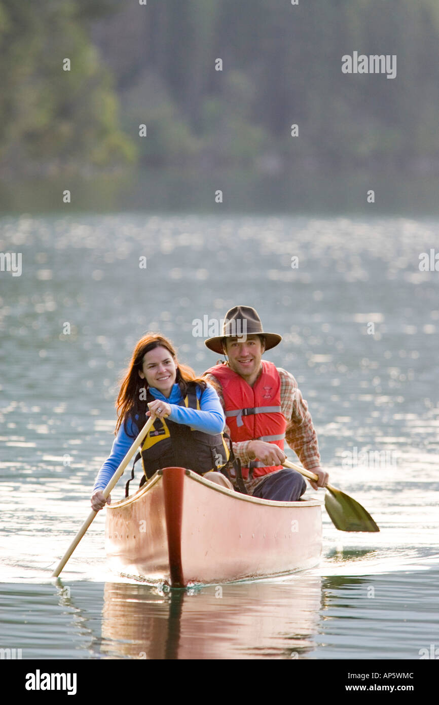 Couple Canoeing on Dickey Lake in Montana (MR) Stock Photo