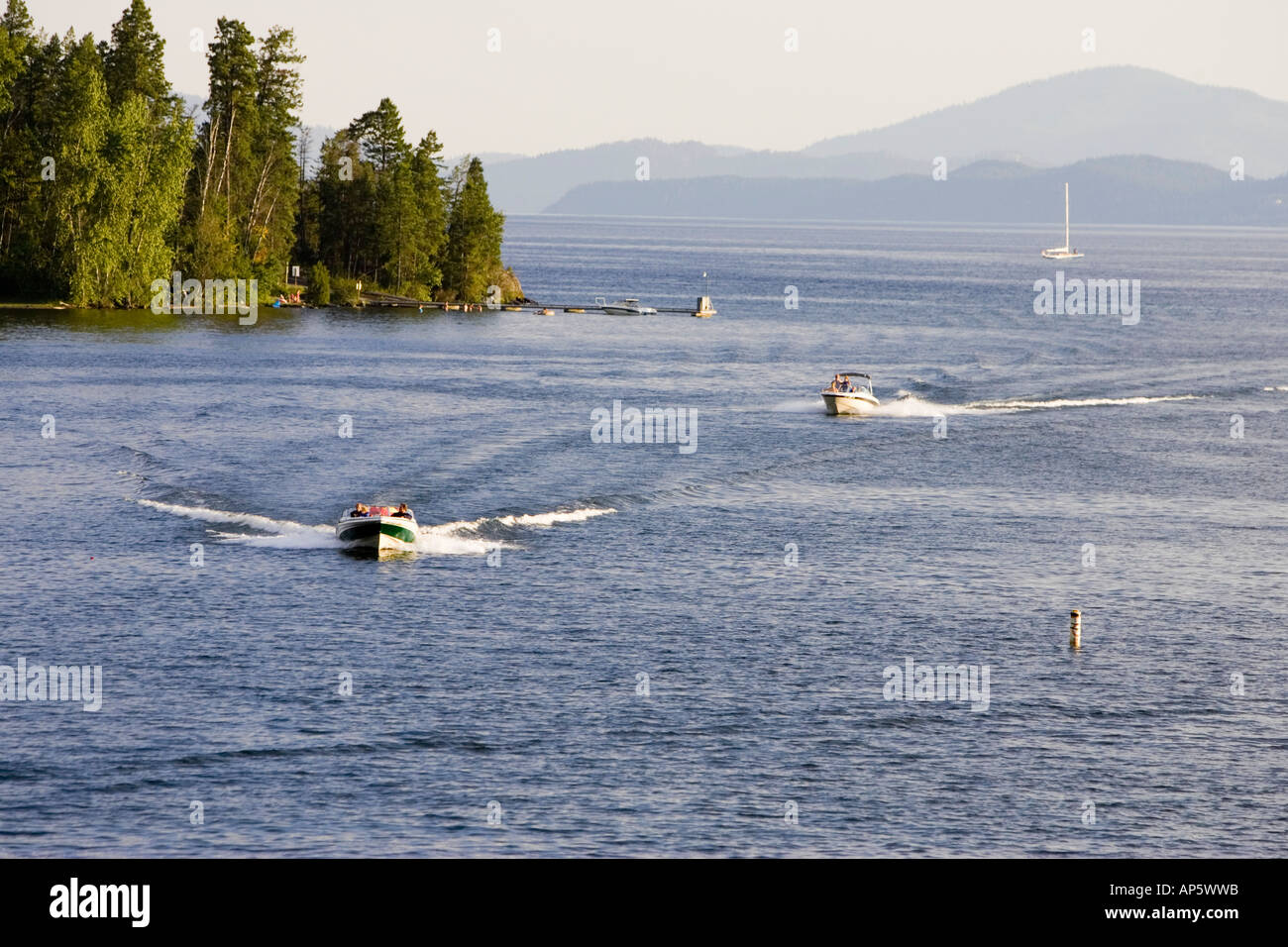 Watercraft comes into Bigfork Bay on Flathead Lake in Montana Stock