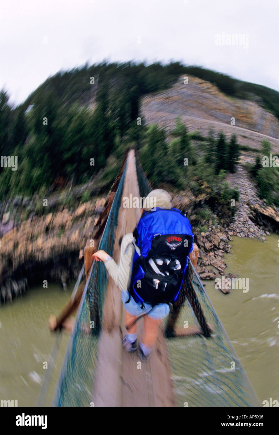 Hiker Crossing Kootenai Falls Swing Bridge Near Libby