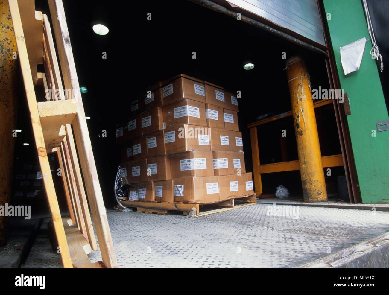 Warehouse in loading area. Wholesale distribution center. Stacks of cartons and boxes on a platform. Commerce, business and industry in USA Stock Photo